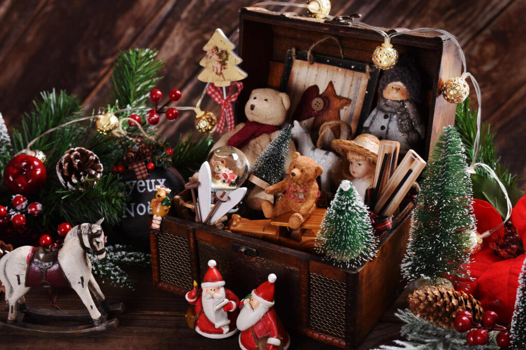 Vintage style Christmas toys and decors in wooden chest