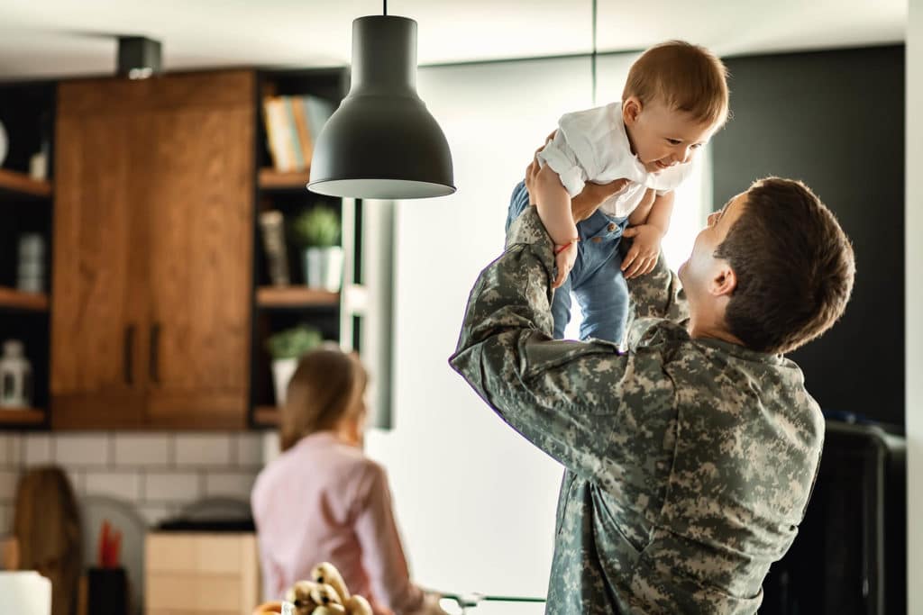Soldier holding a baby