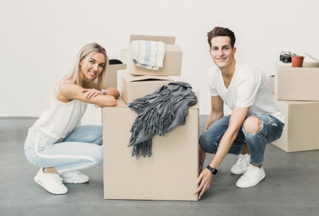 couple leaning on a box