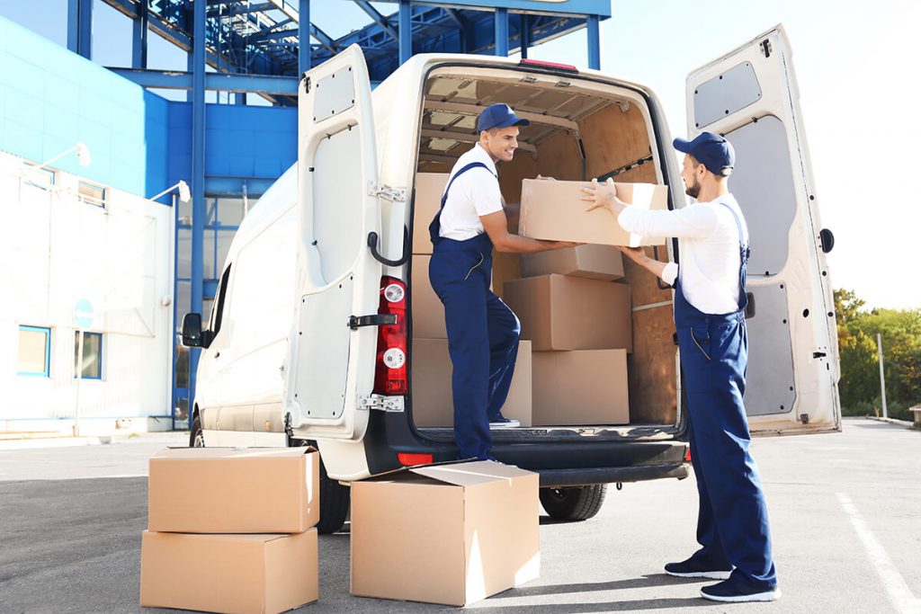Professional movers loading box