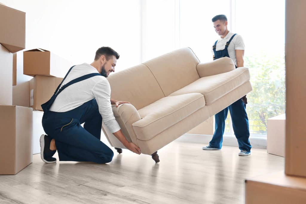 Professional mover carrying the sofa