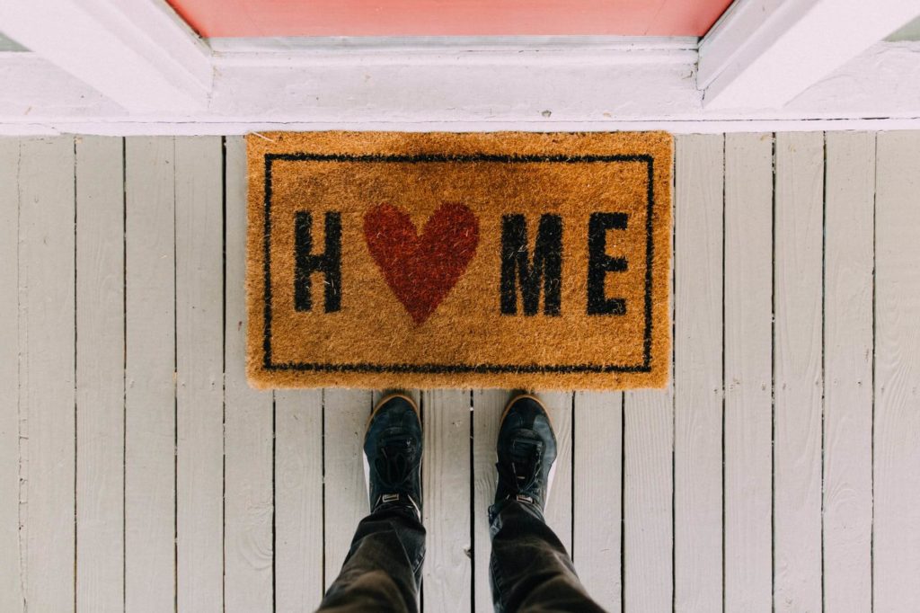 A rug in front of a home