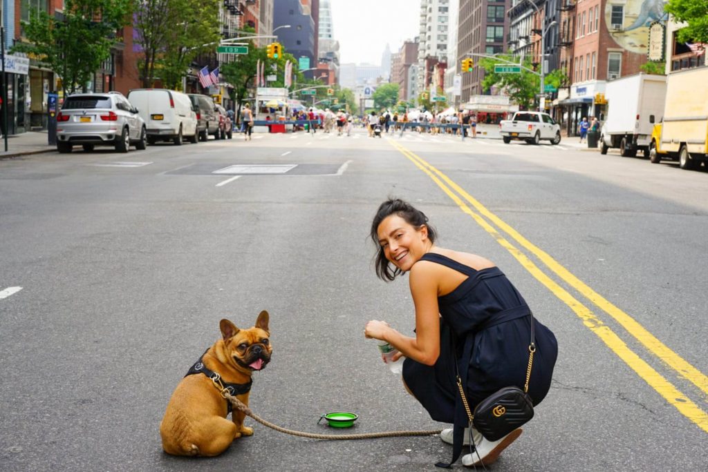 Girl walking a dog after moving state to state