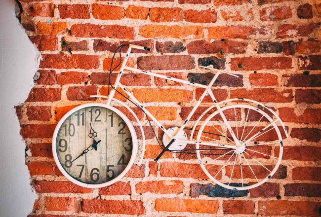 Bicycle clock on the brick wall