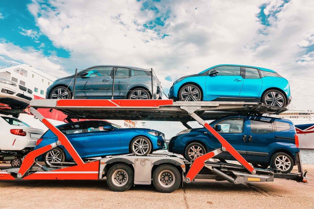Open trailer loaded with cars